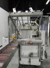 Used Adco Model 15DBC105-EC Automatic Horizontal Cartoner. Capable of speeds from 50 to 125 cartons per minute. Has two head rotary carton feed with 4' long magazine. Machine is set on 12