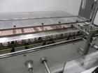 Used Adco Model 15DBC105-EC Automatic Horizontal Cartoner. Capable of speeds from 50 to 125 cartons per minute. Has two head rotary carton feed with 4' long magazine. Machine is set on 12