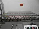 Used Adco Model 15DBC105-EC Automatic Horizontal Cartoner. Capable of speeds from 50 to 125 cartons per minute. Has two head rotary carton feed with 4' long magazine. Machine is set on 12