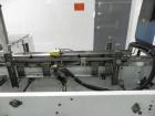 Used Adco Model 15DBC105-EC Automatic Horizontal Cartoner. Capable of speeds from 50 to 125 cartons per minute. Has two head rotary carton feed with 4' long magazine. Machine is set on 12