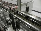 Used Adco Model 15DBC105-EC Automatic Horizontal Cartoner. Capable of speeds from 50 to 125 cartons per minute. Has two head rotary carton feed with 4' long magazine. Machine is set on 12