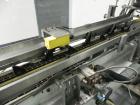 Used Adco Model 15DBC105-EC Automatic Horizontal Cartoner. Capable of speeds from 50 to 125 cartons per minute. Has two head rotary carton feed with 4' long magazine. Machine is set on 12