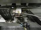Used Adco Model 15DBC105-EC Automatic Horizontal Cartoner. Capable of speeds from 50 to 125 cartons per minute. Has two head rotary carton feed with 4' long magazine. Machine is set on 12