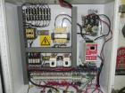 Used Adco Model 15DBC105-EC Automatic Horizontal Cartoner. Capable of speeds from 50 to 125 cartons per minute. Has two head rotary carton feed with 4' long magazine. Machine is set on 12