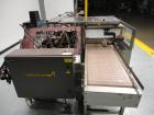 Used Econocorp Spartan Automatic Horizontal Glue Cartoner capable of speeds up to 40 cartons per minute. Has 12
