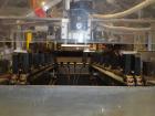 Used Econocorp Spartan Automatic Horizontal Glue Cartoner capable of speeds up to 40 cartons per minute. Has 12