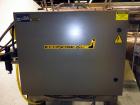 Used Econocorp Spartan Automatic Horizontal Glue Cartoner capable of speeds up to 40 cartons per minute. Has 12