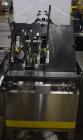 Used Econocorp Econoseal Spartan Automatic Horizontal Intermittent Hotmelt Glue Cartoner. Capable of speeds up to 40 cartons per minute (depending on carton style). Carton size range: 2