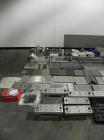 Used Uhlmann Model C2206 Automatic Horizontal Cartoner. Machine is capable of speeds up to 200 cartons per minute. Has 6