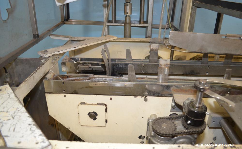 Used Adco Horizontal Glue Cartoner, Model 15E60EC. Has (3) head rotary carton feed. 6' long manual load area. Nordson hot melt glue system. Capable of speeds from 20 to 120 cartons per minute. Has 14...