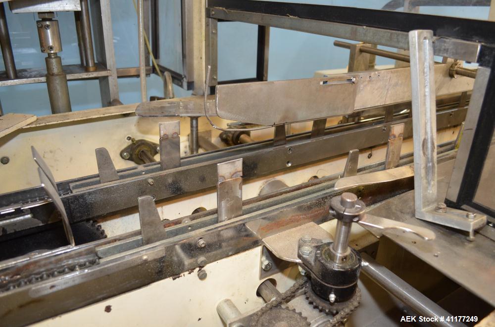 Used Adco Horizontal Glue Cartoner, Model 15E60EC. Has (3) head rotary carton feed. 6' long manual load area. Nordson hot melt glue system. Capable of speeds from 20 to 120 cartons per minute. Has 14...