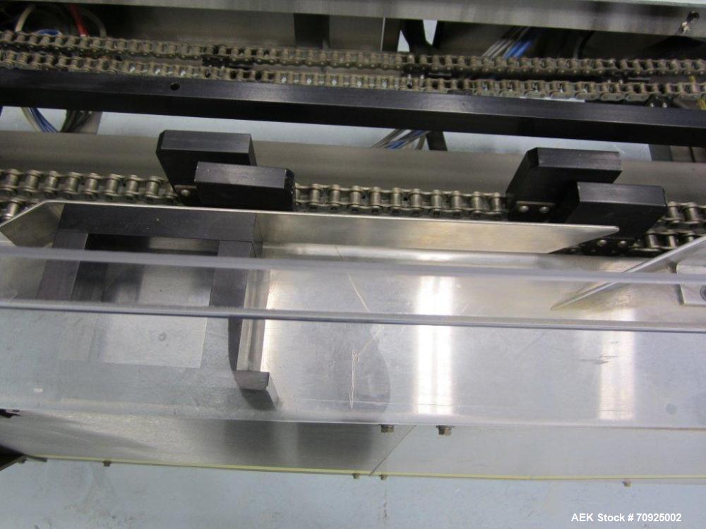 Used Econocorp Spartan Automatic Horizontal Glue Cartoner capable of speeds up to 30-50 cartons per minute. Has 12" centers for carton size range: length 2" - 10" or 51mm to 254mm, width 1" - 4" or 2...