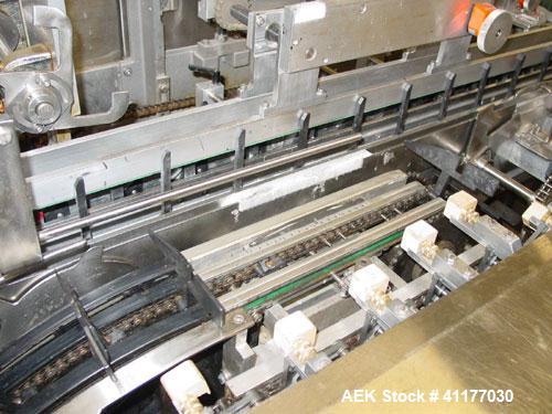 Used Jones Legacy Automatic Quick Change Small Footprint Cartoner. Machine is of Stainless Steel Construction and is capable of speeds up to 400 CPM. Has 4" centers with adjustable buckets for a cart...