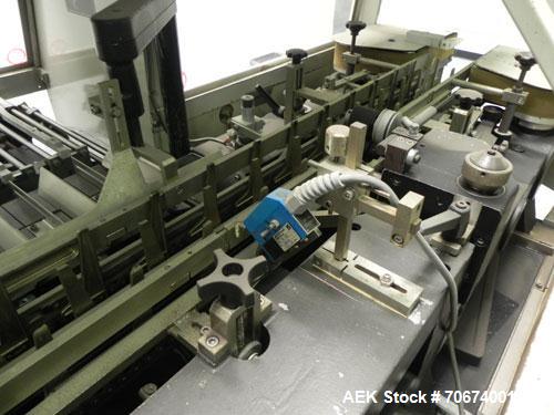 Used Marchesini BA400 Automatic Horizontal Cartoner capable of speeds up to 400 cartons per minute. Has 4" centers for a carton size range: length 25mm - 70mm, width 15mm - 70mm, depth 78mm - 150mm. ...