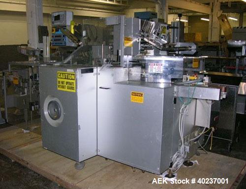 Unused- Uhlmann cartoner, model C100. Rated up to 100 cartons per minute, capable of handling up to 100mm x 85mm x 150mm cartons. 220/380 volt, serial #665.