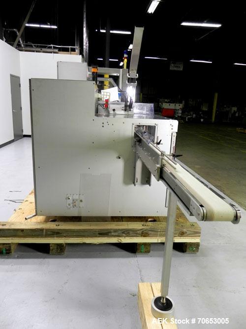 Used Uhlmann Model C2205 Automatic Bottle Cartoner. Capable of speeds up to 250 cartons per minute. Is a continuous motion cartoner. Has a 5" pitch for a Maximum carton size range: (Length) 150mm (6"...