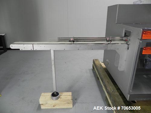 Used Uhlmann Model C2205 Automatic Bottle Cartoner. Capable of speeds up to 250 cartons per minute. Is a continuous motion cartoner. Has a 5" pitch for a Maximum carton size range: (Length) 150mm (6"...