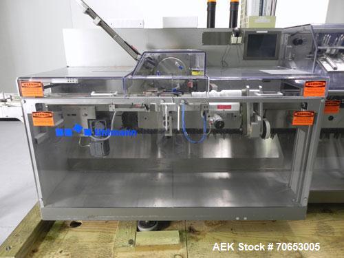 Used Uhlmann Model C2205 Automatic Bottle Cartoner. Capable of speeds up to 250 cartons per minute. Is a continuous motion cartoner. Has a 5" pitch for a Maximum carton size range: (Length) 150mm (6"...