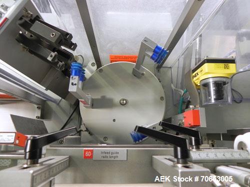 Used Uhlmann Model C2205 Automatic Bottle Cartoner. Capable of speeds up to 250 cartons per minute. Is a continuous motion cartoner. Has a 5" pitch for a Maximum carton size range: (Length) 150mm (6"...