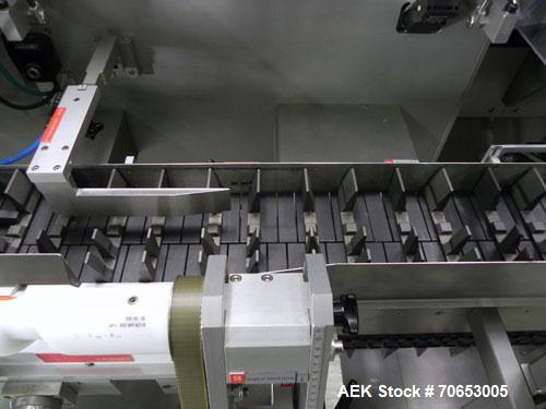 Used Uhlmann Model C2205 Automatic Bottle Cartoner. Capable of speeds up to 250 cartons per minute. Is a continuous motion cartoner. Has a 5" pitch for a Maximum carton size range: (Length) 150mm (6"...
