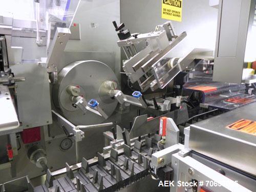 Used Uhlmann Model C2205 Automatic Bottle Cartoner. Capable of speeds up to 250 cartons per minute. Is a continuous motion cartoner. Has a 5" pitch for a Maximum carton size range: (Length) 150mm (6"...