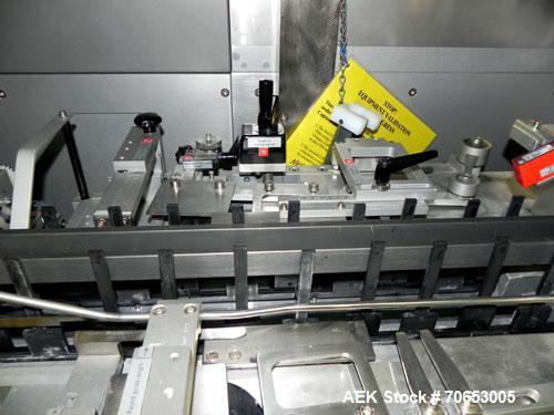 Used Uhlmann Model C2205 Automatic Bottle Cartoner. Capable of speeds up to 250 cartons per minute. Is a continuous motion cartoner. Has a 5" pitch for a Maximum carton size range: (Length) 150mm (6"...