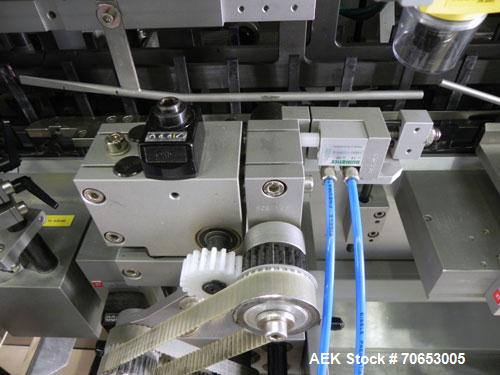 Used Uhlmann Model C2205 Automatic Bottle Cartoner. Capable of speeds up to 250 cartons per minute. Is a continuous motion cartoner. Has a 5" pitch for a Maximum carton size range: (Length) 150mm (6"...