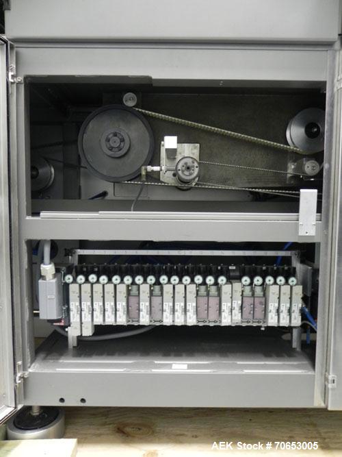 Used Uhlmann Model C2205 Automatic Bottle Cartoner. Capable of speeds up to 250 cartons per minute. Is a continuous motion cartoner. Has a 5" pitch for a Maximum carton size range: (Length) 150mm (6"...