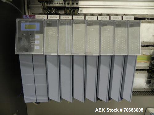 Used Uhlmann Model C2205 Automatic Bottle Cartoner. Capable of speeds up to 250 cartons per minute. Is a continuous motion cartoner. Has a 5" pitch for a Maximum carton size range: (Length) 150mm (6"...