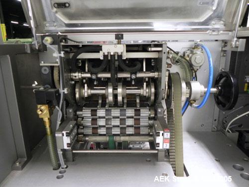 Used Uhlmann Model C2205 Automatic Bottle Cartoner. Capable of speeds up to 250 cartons per minute. Is a continuous motion cartoner. Has a 5" pitch for a Maximum carton size range: (Length) 150mm (6"...