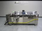 Used Econocorp Spartan Automatic Horizontal Glue Cartoner capable of speeds up to 30-50 cartons per minute. Has 12