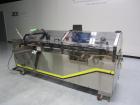 Used Econocorp Spartan Automatic Horizontal Glue Cartoner capable of speeds up to 30-50 cartons per minute. Has 12