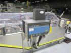 Used Econocorp Spartan Automatic Horizontal Glue Cartoner capable of speeds up to 30-50 cartons per minute. Has 12