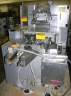 Unused- Uhlmann cartoner, model C100. Rated up to 100 cartons per minute, capable of handling up to 100mm x 85mm x 150mm cartons. 220/380 volt, serial #665.