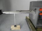 Used Uhlmann Model C2205 Automatic Bottle Cartoner. Capable of speeds up to 250 cartons per minute. Is a continuous motion cartoner. Has a 5