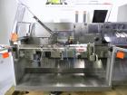 Used Uhlmann Model C2205 Automatic Bottle Cartoner. Capable of speeds up to 250 cartons per minute. Is a continuous motion cartoner. Has a 5