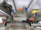 Used Uhlmann Model C2205 Automatic Bottle Cartoner. Capable of speeds up to 250 cartons per minute. Is a continuous motion cartoner. Has a 5