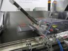 Used Uhlmann Model C2205 Automatic Bottle Cartoner. Capable of speeds up to 250 cartons per minute. Is a continuous motion cartoner. Has a 5