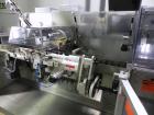 Used Uhlmann Model C2205 Automatic Bottle Cartoner. Capable of speeds up to 250 cartons per minute. Is a continuous motion cartoner. Has a 5