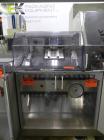 Used Uhlmann Model C2205 Automatic Bottle Cartoner. Capable of speeds up to 250 cartons per minute. Is a continuous motion cartoner. Has a 5