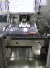 Used Uhlmann Model C2205 Automatic Bottle Cartoner. Capable of speeds up to 250 cartons per minute. Is a continuous motion cartoner. Has a 5