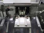 Used Uhlmann Model C2205 Automatic Bottle Cartoner. Capable of speeds up to 250 cartons per minute. Is a continuous motion cartoner. Has a 5