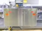 Used Uhlmann Model C2205 Automatic Bottle Cartoner. Capable of speeds up to 250 cartons per minute. Is a continuous motion cartoner. Has a 5