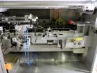 Used Uhlmann Model C2205 Automatic Bottle Cartoner. Capable of speeds up to 250 cartons per minute. Is a continuous motion cartoner. Has a 5