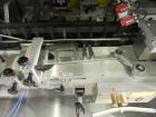 Used Uhlmann Model C2205 Automatic Bottle Cartoner. Capable of speeds up to 250 cartons per minute. Is a continuous motion cartoner. Has a 5