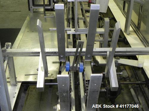 Used Adco Semi Automatic Horizontal Cartoner, Model 15DEC. Capable of speeds up to 60 cpm. Has 14" centers for a carton size range: length 1" to 12", width up to 3", and depth 5" to 12". Has Nordson ...