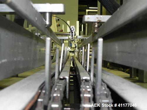 Used Adco Semi Automatic Horizontal Cartoner, Model 15DEC. Capable of speeds up to 60 cpm. Has 14" centers for a carton size range: length 1" to 12", width up to 3", and depth 5" to 12". Has Nordson ...