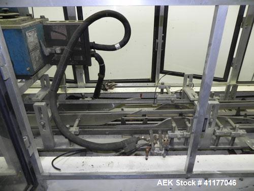 Used Adco Semi Automatic Horizontal Cartoner, Model 15DEC. Capable of speeds up to 60 cpm. Has 14" centers for a carton size range: length 1" to 12", width up to 3", and depth 5" to 12". Has Nordson ...