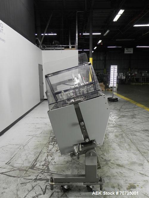Used Langen Model B1 Semi-Automatic Horizontal Cartoner capable of speeds up to 120 cartons per minute. Has 9" centers with 3 chain carrier (can be converted to a 4 chain carrier) for a carton size r...