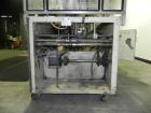 Used Adco Semi Automatic Horizontal Cartoner, Model 15DEC. Capable of speeds up to 60 cpm. Has 14